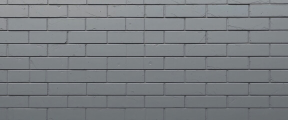Sleek modern grey brick texture with uniform rectangular bricks, smooth surfaces, and sharp clean lines, giving a contemporary architectural look