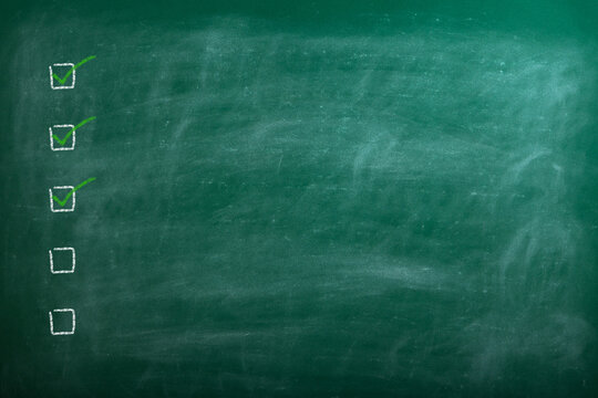 Checklist at the blackboard with copy space