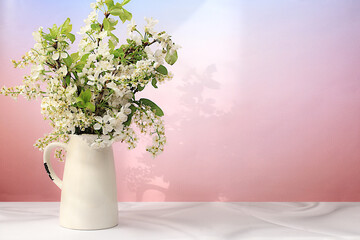 Beautiful spring blossoming apple tree branches in vase on elegant background. Abstract flower arrangement and banner for screen, Still life with place for text, Floral holiday card