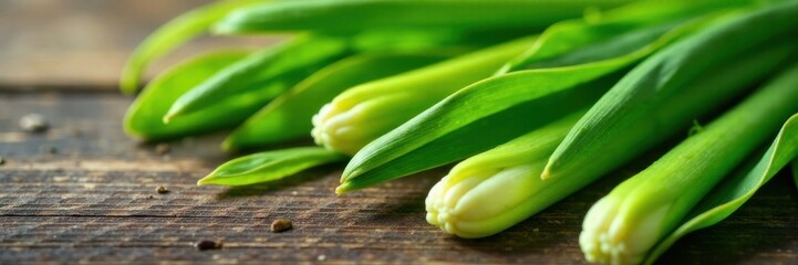 Fototapeta premium Close-up of exotic lemongrass leaves on a wooden surface, foliage, herbs, wood