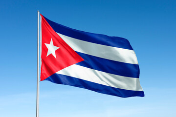 Fototapeta premium Waving Cuban flag, national symbol, blue sky