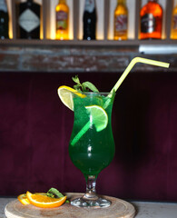 green cocktail with lime