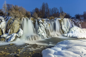 Muradiye Waterfall in Muradiye District. Van, Turkey. Beautiful waterfall landscape on winter. Waterfall is a natural wonder near Van Lake.The famous waterfall freezes in winter.
