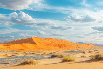 Naklejka premium Expansive desert landscape showcasing vibrant orange dunes under a vast blue sky