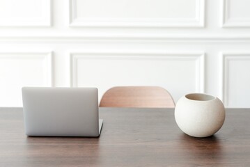 Minimal home office and workspace with laptop on the table