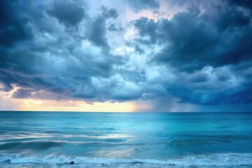 Obraz premium Dramatic clouds loom over a calm ocean during twilight, creating a stunning contrast of colors and textures on the horizon