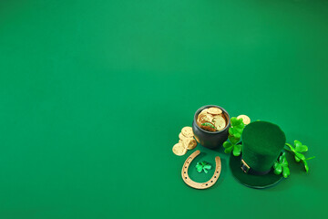 St. Patrick's Day Symbols. A festive green scene with a leprechaun hat, gold coins, horseshoe