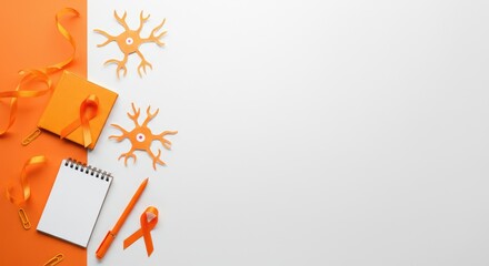 Orange ribbons, pen, notepad, and neuron structure representing Multiple Sclerosis Awareness