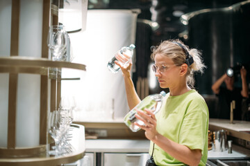 The production designer prepares the scenery on the set. The artist's work in building a frame for filming a movie, advertising, TV series. Modern photography technique.