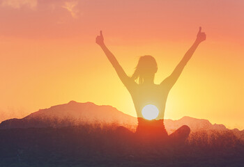Think Positive, Happy Mindset, Happy Woman Sitting In the Park Thumbs Up to the Sunrise 