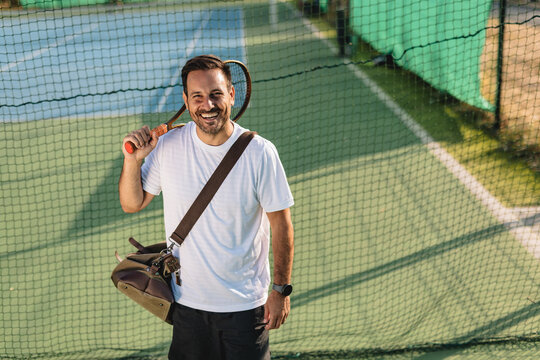 Young couple playing tennis outdoors enjoying a fun summer game