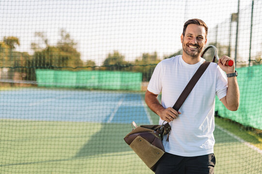 Young couple playing tennis outdoors enjoying a fun summer game