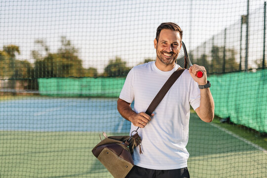 Young couple playing tennis outdoors enjoying a fun summer game
