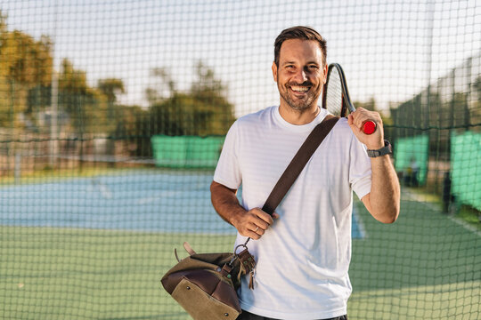 Young couple playing tennis outdoors enjoying a fun summer game