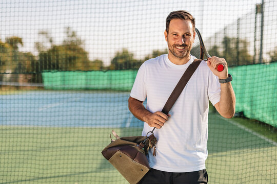 Young couple playing tennis outdoors enjoying a fun summer game