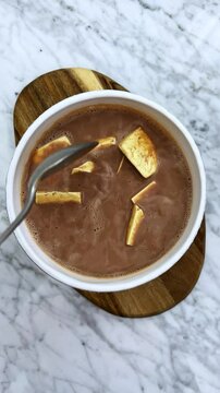 Delicious bowl of hot creamy chocolate with fresh cheese   