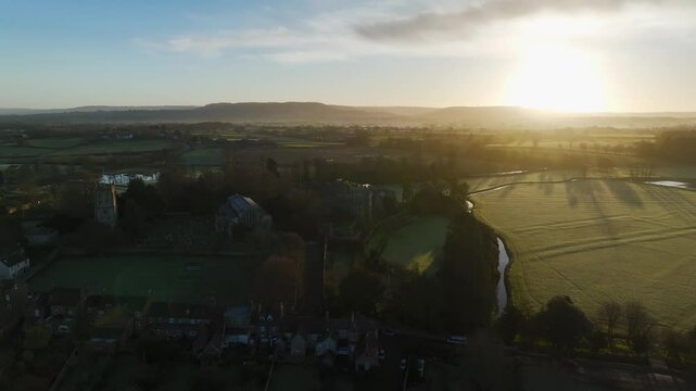 Sunrise over Berkeley Castle from a drone, Berkeley, Cotswolds, Gloucestershire, England