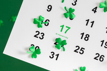 Top view of a paper calendar sheet with the selected date March 17 and the text 