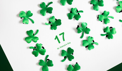  St. Patrick's Day celebration.Top view of a paper calendar sheet with the selected date March 17...