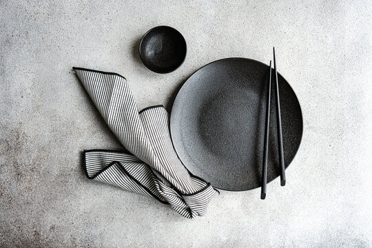Minimalist black and white table setting with chopstick