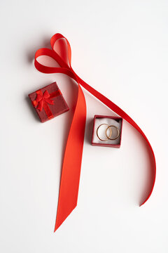 Top view of St. Valentine's Day gift and wedding rings