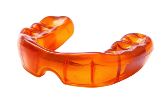 Bright orange sports mouthguard resting on a clean surface before a competitive game isolated on transparent background - Powered by Adobe