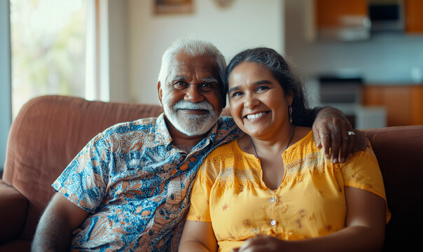Happy Aboriginal senior couple together in a bright room, family at home, generated ai