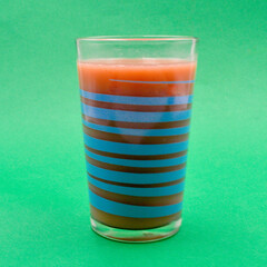A closeup of a mixed berry smoothie in a glass.