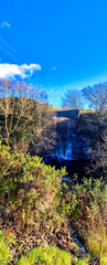 A Stunning Waterfall Within The Heart Of The Scottish Highlands