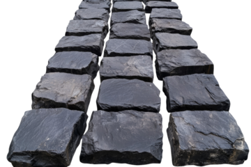 Row of black stones are laid out in a row, isolated