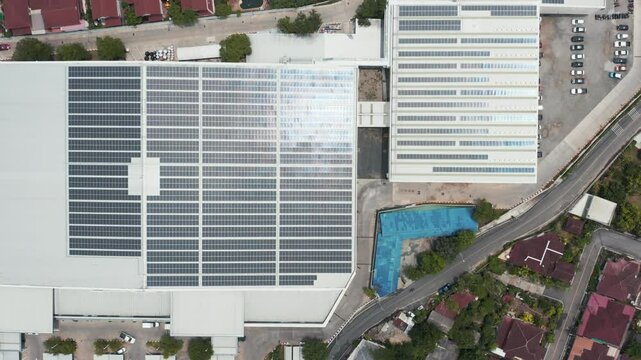 Eco building of shopping center in aerial view consist of solar or photovoltaic cell in panel on top of roof. Technology to generate electrical power, direct current electricity. Energy for future.
