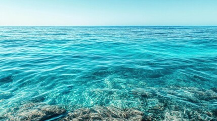 Obraz premium Serene Tropical Ocean View with Crystal Clear Water and Gentle Waves in Bright Daylight