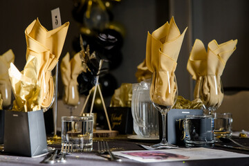 Elegant black and gold table decorations for wedding reception