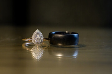 Elegant black and gold teardrop wedding rings