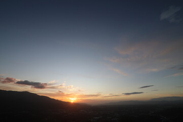 Mountains at sunset with colorful sky above landscape