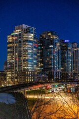 Obraz premium The skyline of Vancouver City at Sunset. The skyline of Vancouver City at Sunset. Lights are on in apartment buildings 
