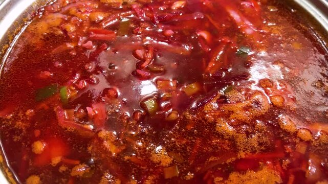 Ukrainian borscht is cooked in a saucepan on the stove.