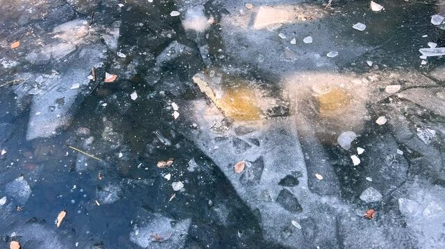 The ice surface of a frozen pond in winter.