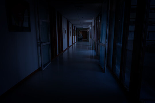 Dark empty corridor in hospital building at night