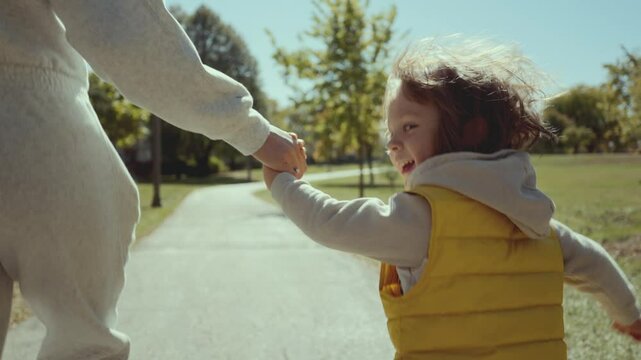 Happy family Mother and Child Walking Smiling Outdoor. Slow motion