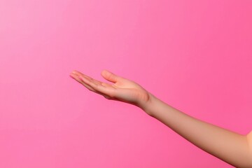 Hand on pink background, concept of giving, receiving, holding. Abstract presentation