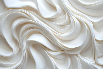 Fototapeta premium Abstract swirls of white frosting. Texture of whipped cream. Close-up. Background. Possible use in food design, cooking, baking