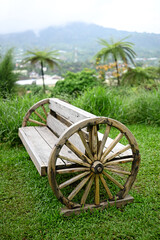 Wooden garden chair, placed in the middle of the park