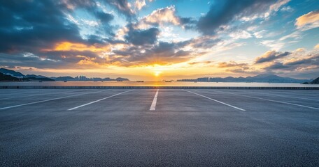 Empty coastal parking lot sunset, cityscape background