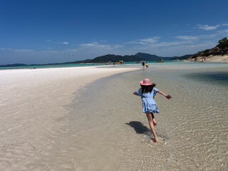Tourists visit on Whitehaven Beach at Whitsunday Islands National Park Queensland Australia