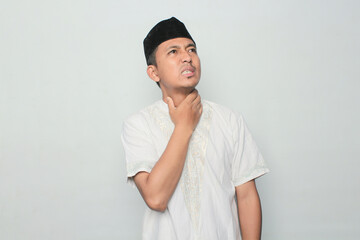 Asian muslim man expresses his thirst in front of the camera.