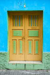 old wooden window on blue wall