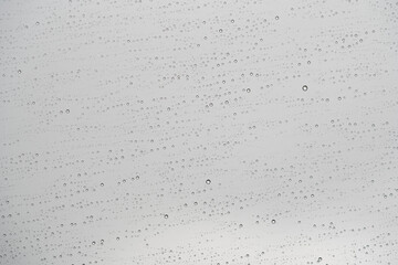 textura formada por repetición de gotas de lluvia con fondo gris claro © AnaPliego