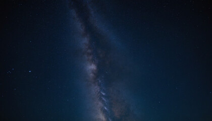 Fototapeta premium Stunning view of the Milky Way galaxy with stars and dark sky, perfect for astrophotography and cosmic exploration