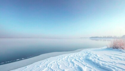 Obraz premium Calm Winter Lake under Clear Blue Sky